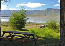 clean picnic table after park clean up, with lake and mountains in backgound clean picnic table after park clean up, with lake and mountains in backgound