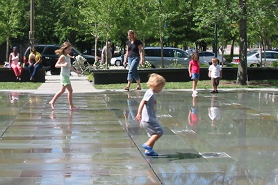 very shallow splash fountain with children very shallow splash fountain with children