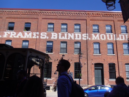 faded sign for old factory on repurposed building faded sign for old factory on repurposed building