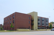 attractive brick and concrete multi-family housing built by faith-based organization