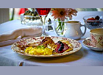 bountiful breakfast on white linen tablecloth