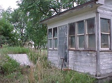 abandoned rural home and storm cellar