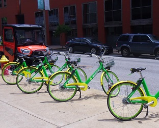shared bikes on a city sidewalk