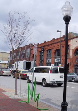 arts districts may encourage development of an economic specialty that attracts creatives budding arts district in Baltimore