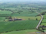 green fields shown in aerial view