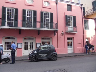 policeman talking with motorcyclist outside Brennan's restaurant in New Orleans policeman talking with motorcyclist outside Brennan's restaurant in New Orleans