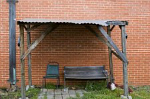 old bench under makeshift roof