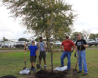 volunteers pause to enjoy their tree planting project volunteers pause to enjoy their tree planting project