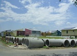 large culverts awaiting installation in New Orleans neighborhood impacted by Katrina