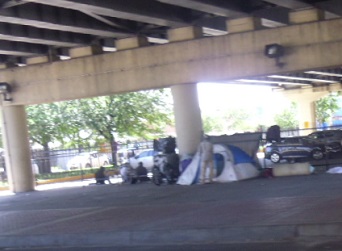 Tents and Blankets under Bridge homelessness under bridge New Orleans