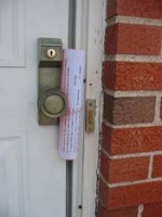 homeowner newsletter tied onto doorknob with rubber band homeowner newsletter tied onto doorknob with rubber band