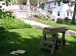 sawhorse and lumber on lawn