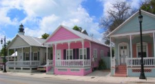 infill housing consisting of small pastel cottages