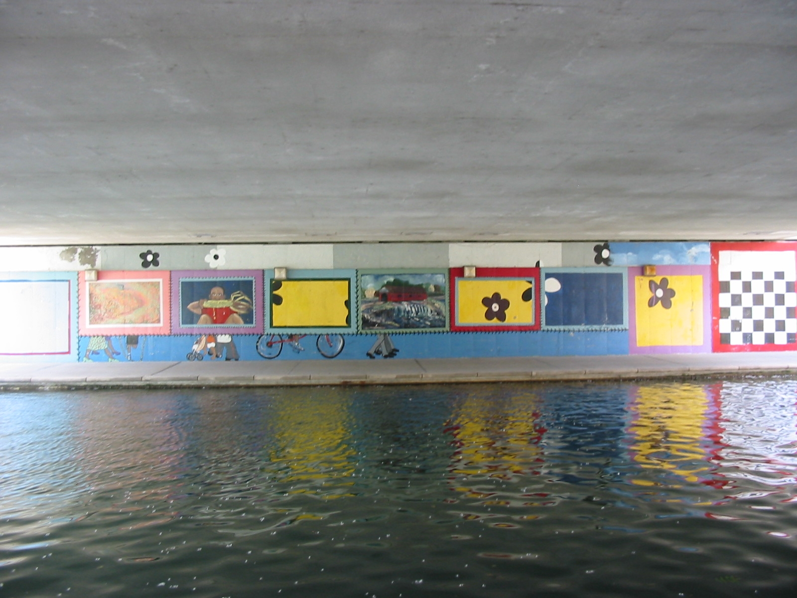 series of paintings seems to be on top of other graphics but not covering them up