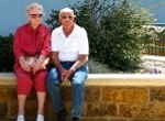 older adults on a seating wall