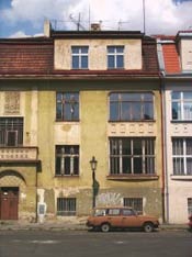 slightly shabby but pretty building in area probably in need of neighborhood revitalization slightly shabby but pretty building in area probably in need of neighborhood revitalization