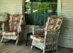 wicker chairs on front porch