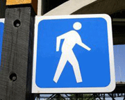 urban form conducive to walking may support healthy lifestyle pedestrian symbol on blue sign