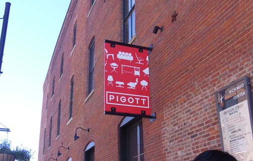 red sign fastened to brick building red sign fastened to brick building