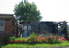 brick building where entire front wall is missing