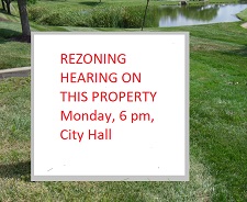 rezoning hearing notice sign on lakeside commercial property rezoning hearing notice sign on lakeside commercial property