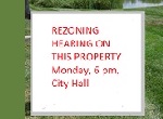 rezoning notice sign on lawn