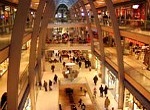 looking down at ground floor of a somewhat busy shopping center