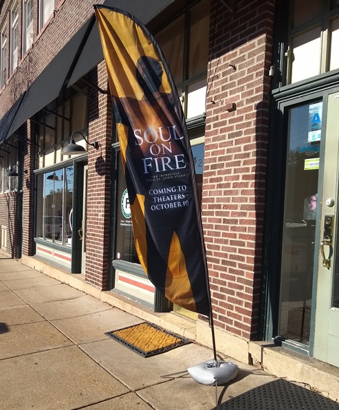 large sail sign mounted on some weighted bags that are clearly temporary large sail sign mounted on some weighted bags that are clearly temporary