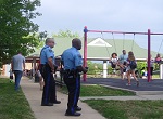 two policemen at a neighborhood event