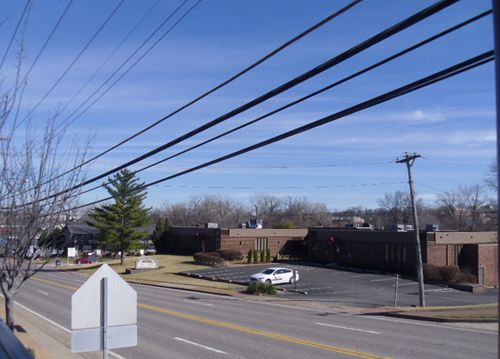 heavy power lines in suburban commercial area