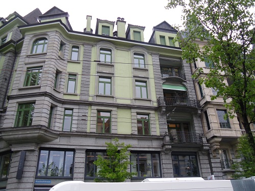 gray multi-story multi-family residence