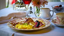 tourist homes offer advantages to cities and can minimize neighborhood impacts American style big breakfast on white tablecloth