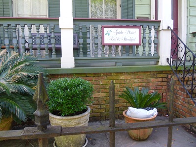 tourist homes offer advantages to cities and can minimize neighborhood impacts bed and breakfast porch and sign New Orleans