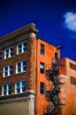 multi-story building with fire escape, all subject to zoning regulations multi-story building with fire escape, all subject to zoning regulations